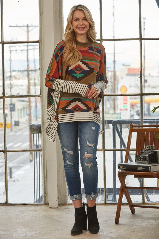 Azi Two Fer Poncho featuring a modern Aztec print, lightweight fabric, and stylish high neck design.