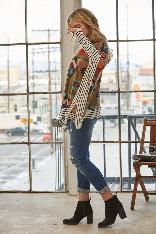 Azi Two Fer Poncho featuring a modern Aztec print, lightweight fabric, and stylish high neck design.