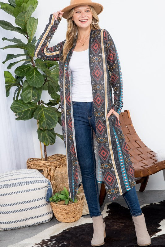 Aztec Print Duster Cardigan featuring an open front, long sleeves, and side pockets, made from cozy angora knit fabric.