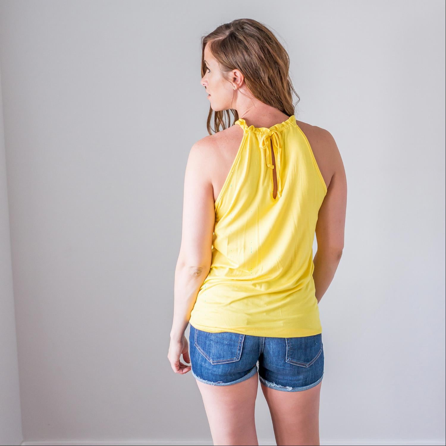 Back Keyhole Halter Tank showcasing a stylish halter neck and cute cut-out back design, perfect for summer outings.