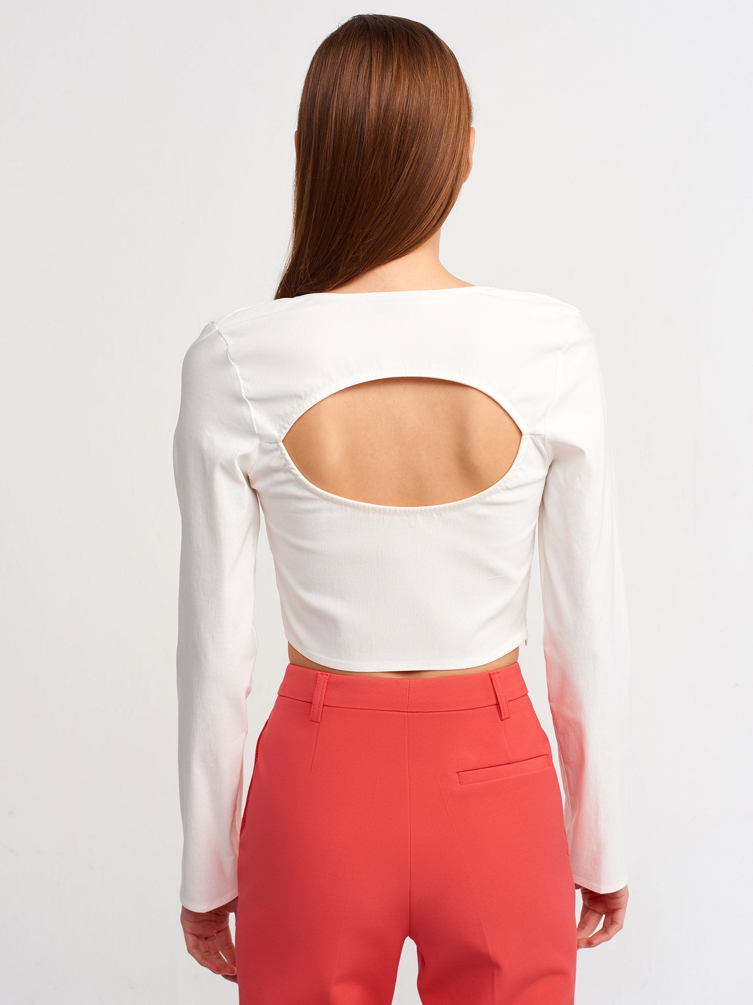 A stylish backless square neck top in a soft fabric blend, showcasing its elegant design and modern silhouette.