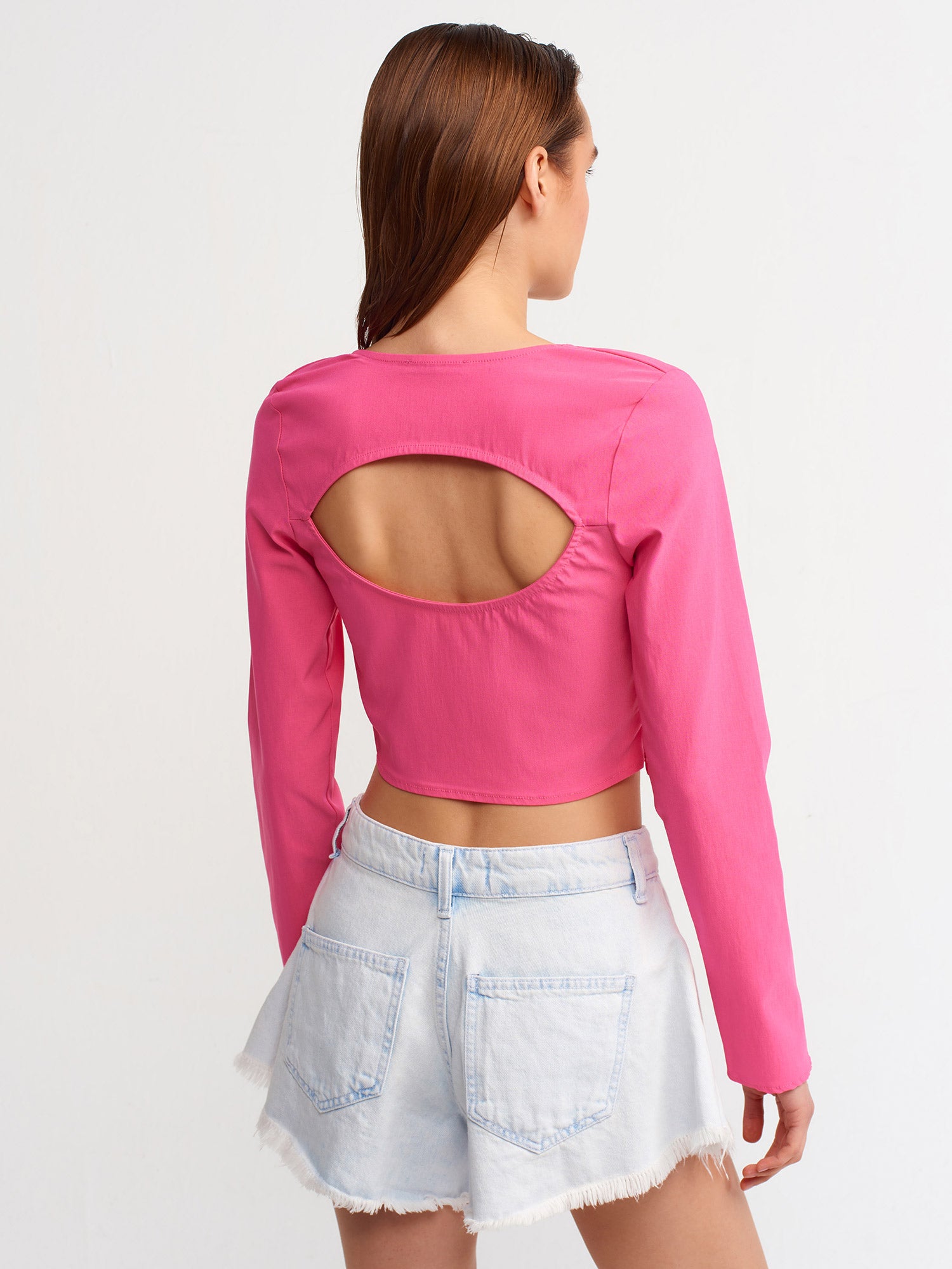 A stylish backless square neck top in a soft fabric blend, showcasing its elegant design and modern silhouette.