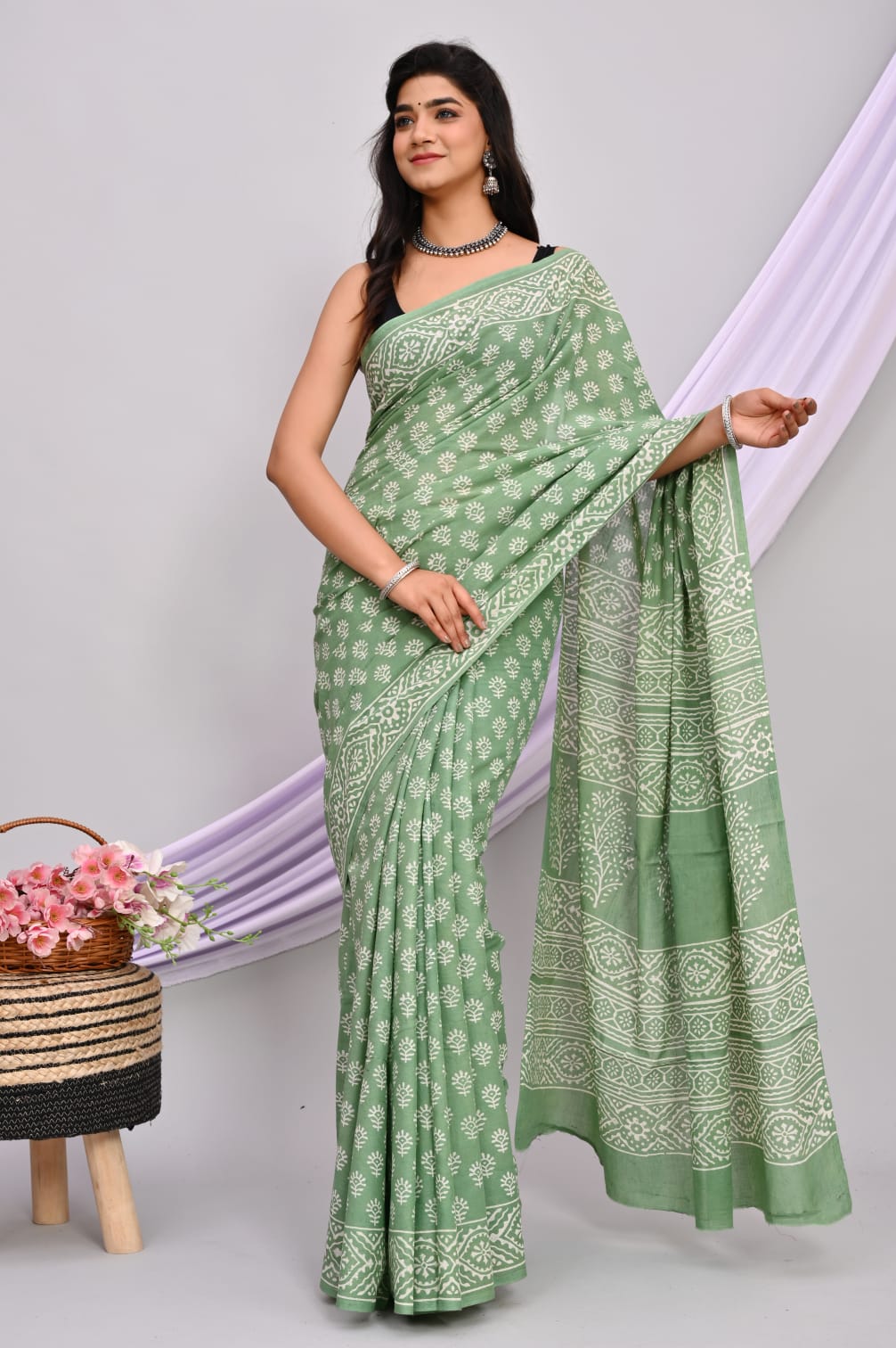 A beautiful Bagru hand block printed Kota Doria saree showcasing intricate patterns and vibrant colors, draped elegantly.