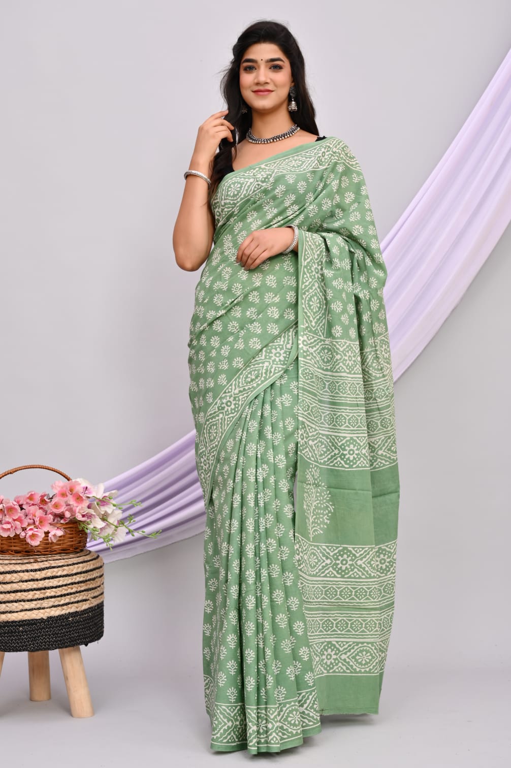 A beautiful Bagru hand block printed Kota Doria saree showcasing intricate patterns and vibrant colors, draped elegantly.