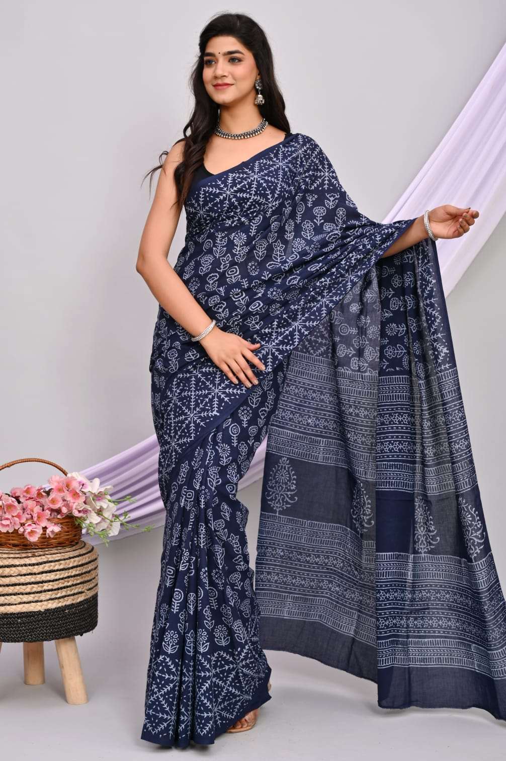 A beautiful Bagru hand block printed Kota Doria saree showcasing intricate patterns and vibrant colors, draped elegantly.