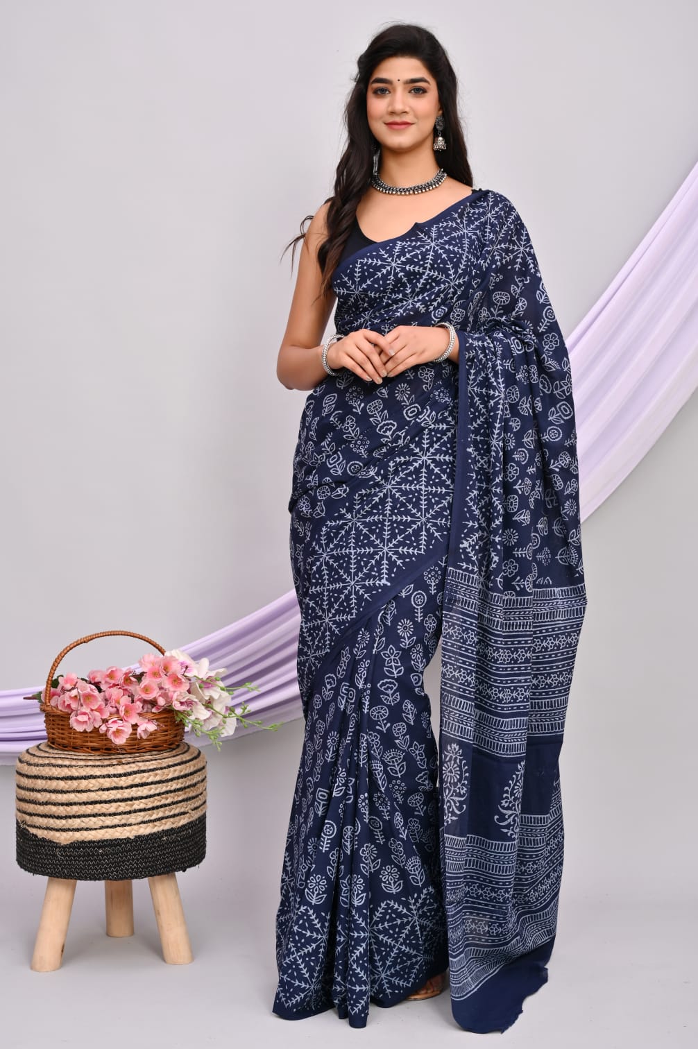 A beautiful Bagru hand block printed Kota Doria saree showcasing intricate patterns and vibrant colors, draped elegantly.