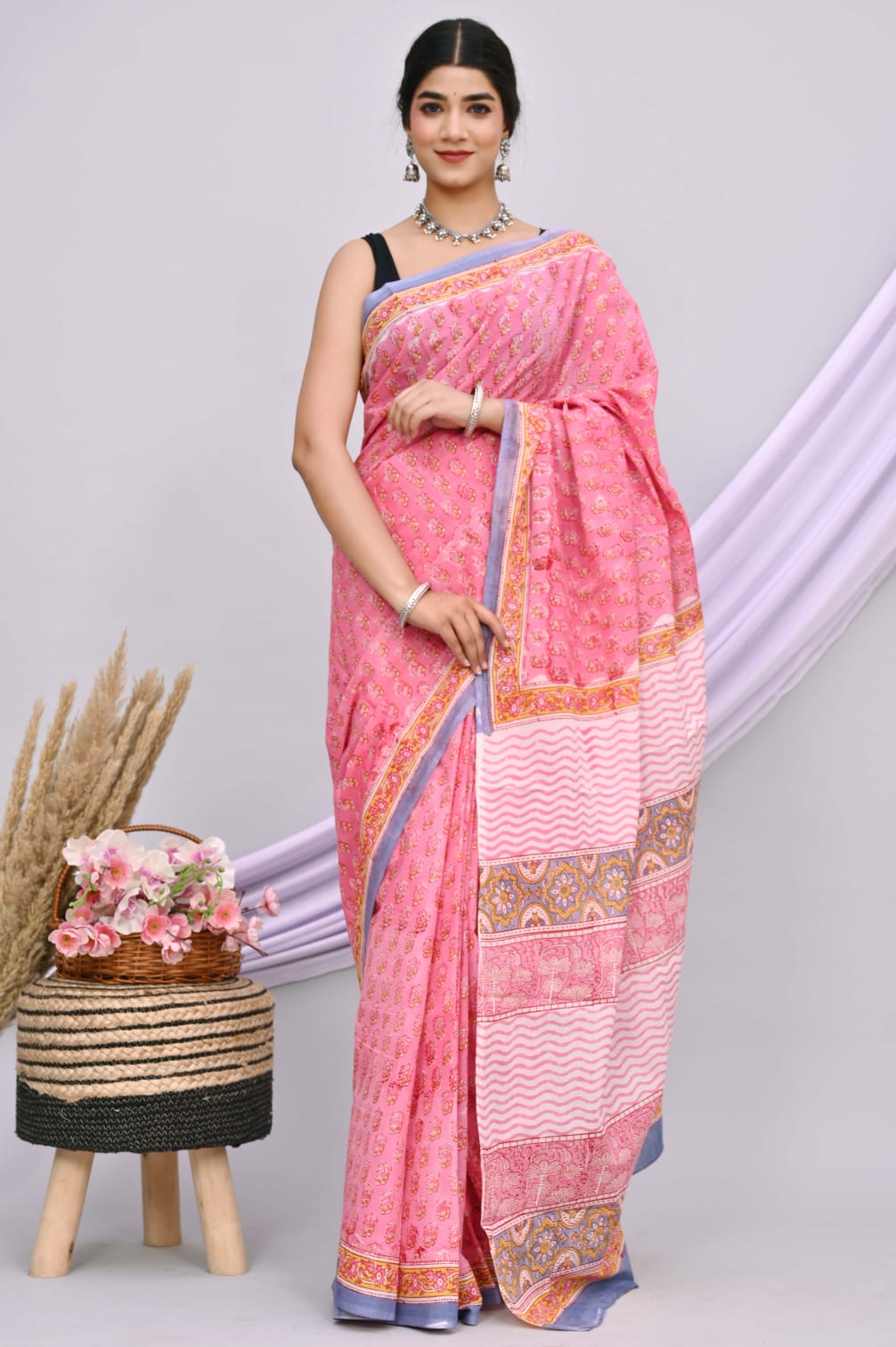 A beautiful Bagru hand block printed Kota Doria saree showcasing intricate patterns and vibrant colors, draped elegantly.