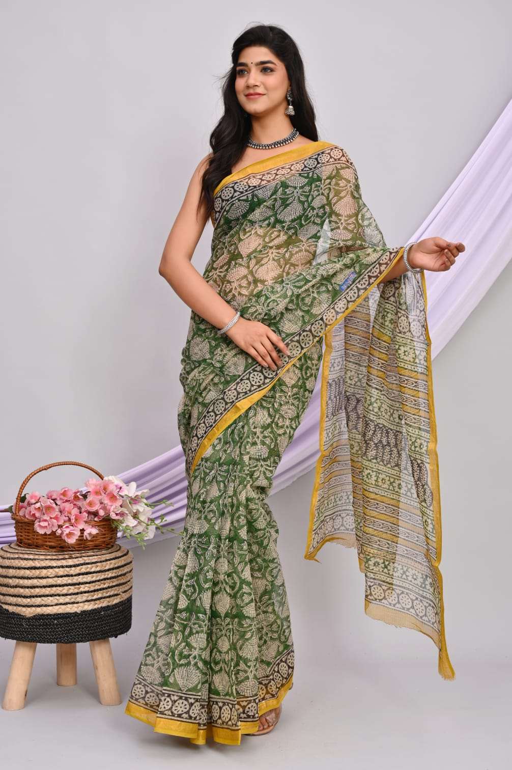 A beautiful Bagru hand block printed Kota Doria saree showcasing intricate patterns and vibrant colors, draped elegantly.