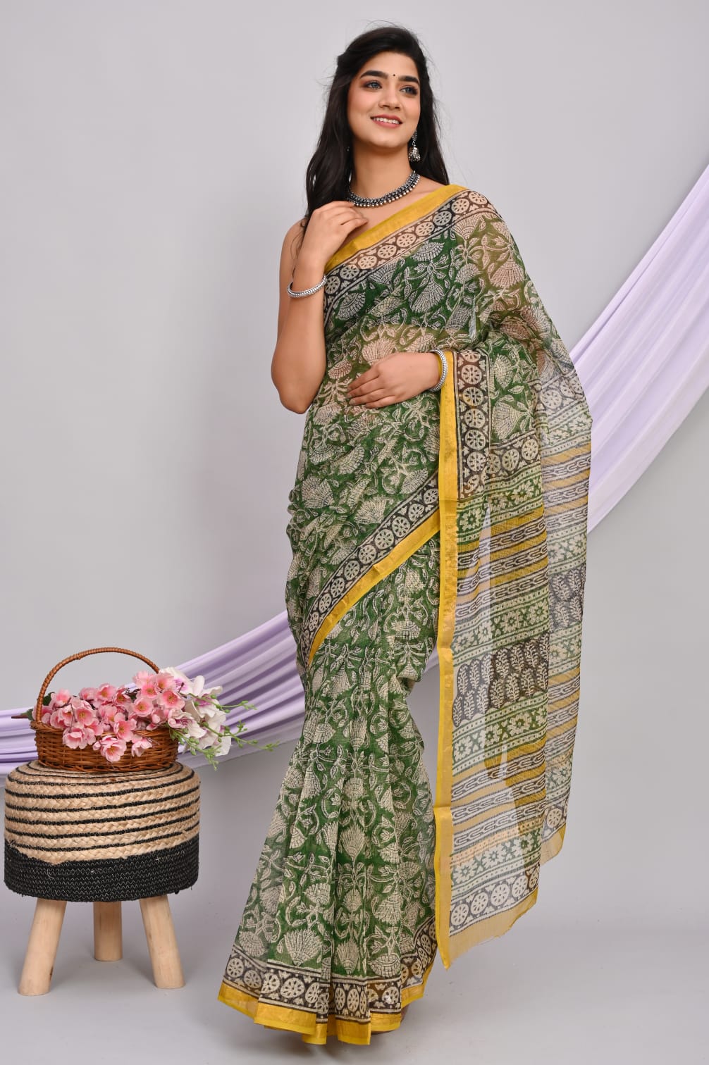 A beautiful Bagru hand block printed Kota Doria saree showcasing intricate patterns and vibrant colors, draped elegantly.