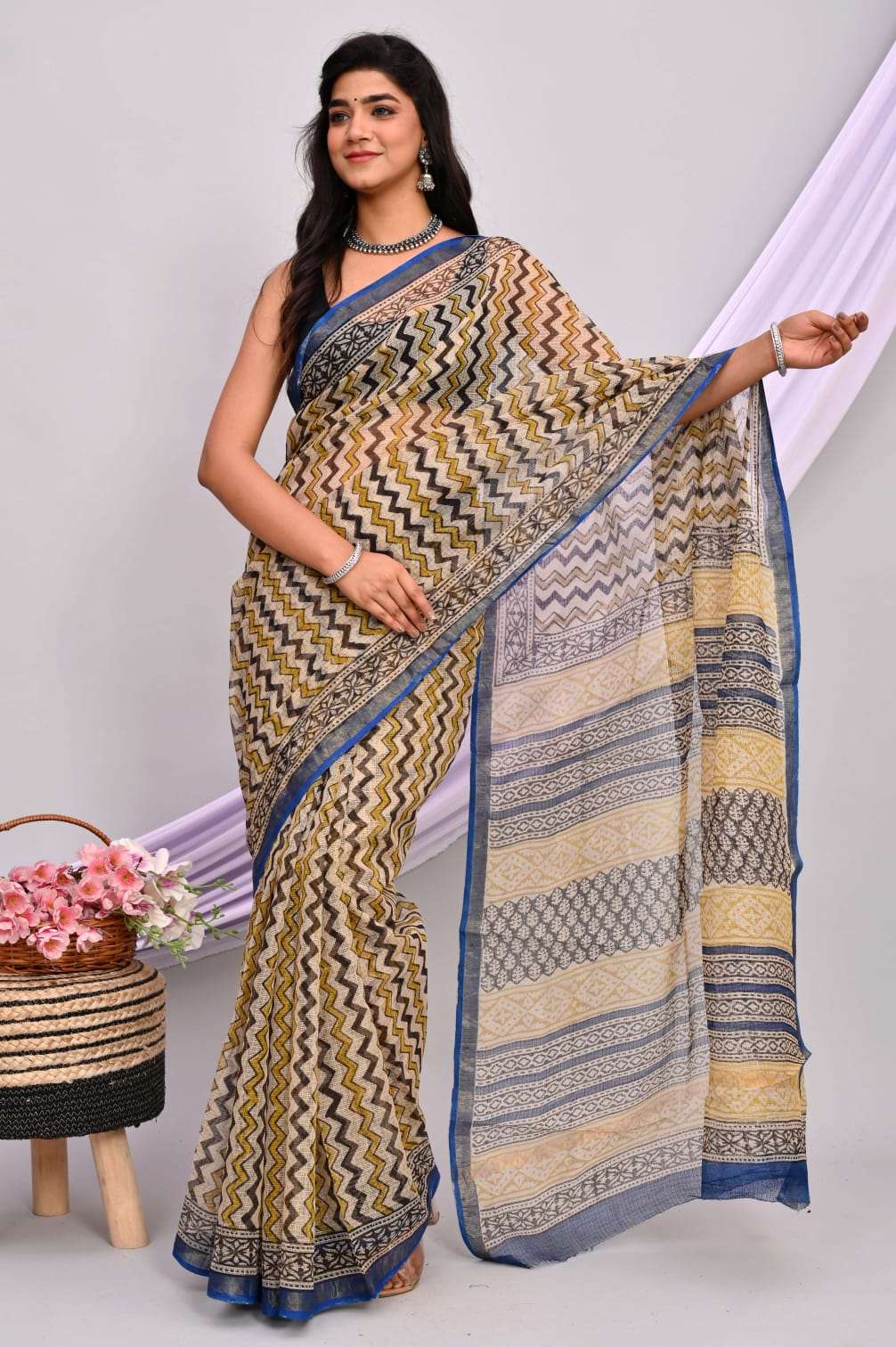 A beautiful Bagru hand block printed Kota Doria saree showcasing intricate patterns and vibrant colors, draped elegantly.