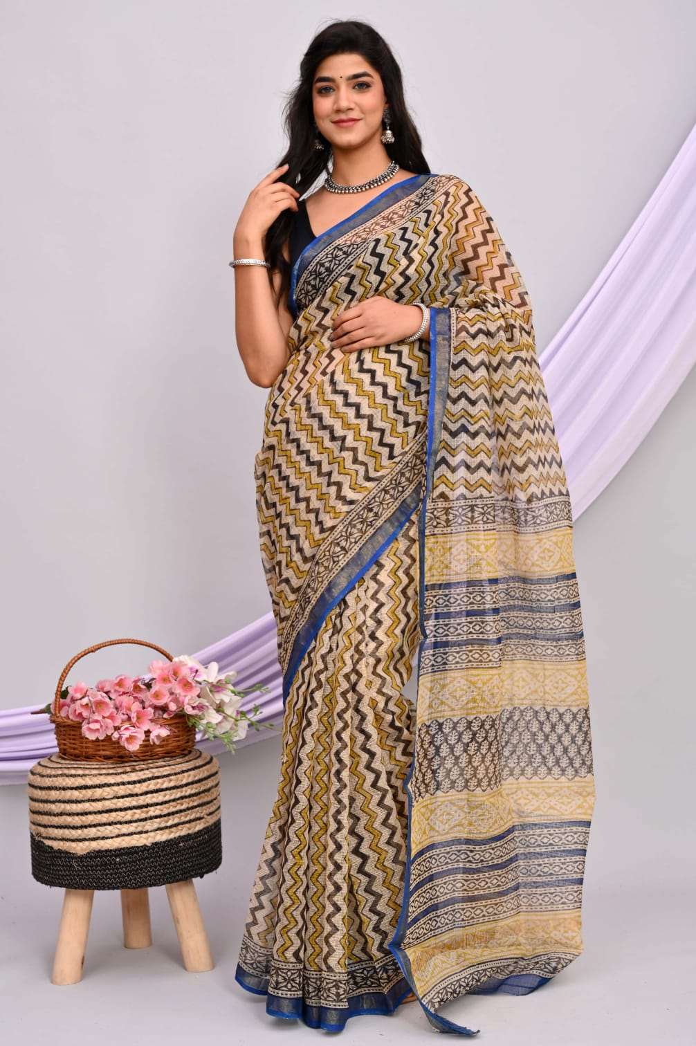 A beautiful Bagru hand block printed Kota Doria saree showcasing intricate patterns and vibrant colors, draped elegantly.