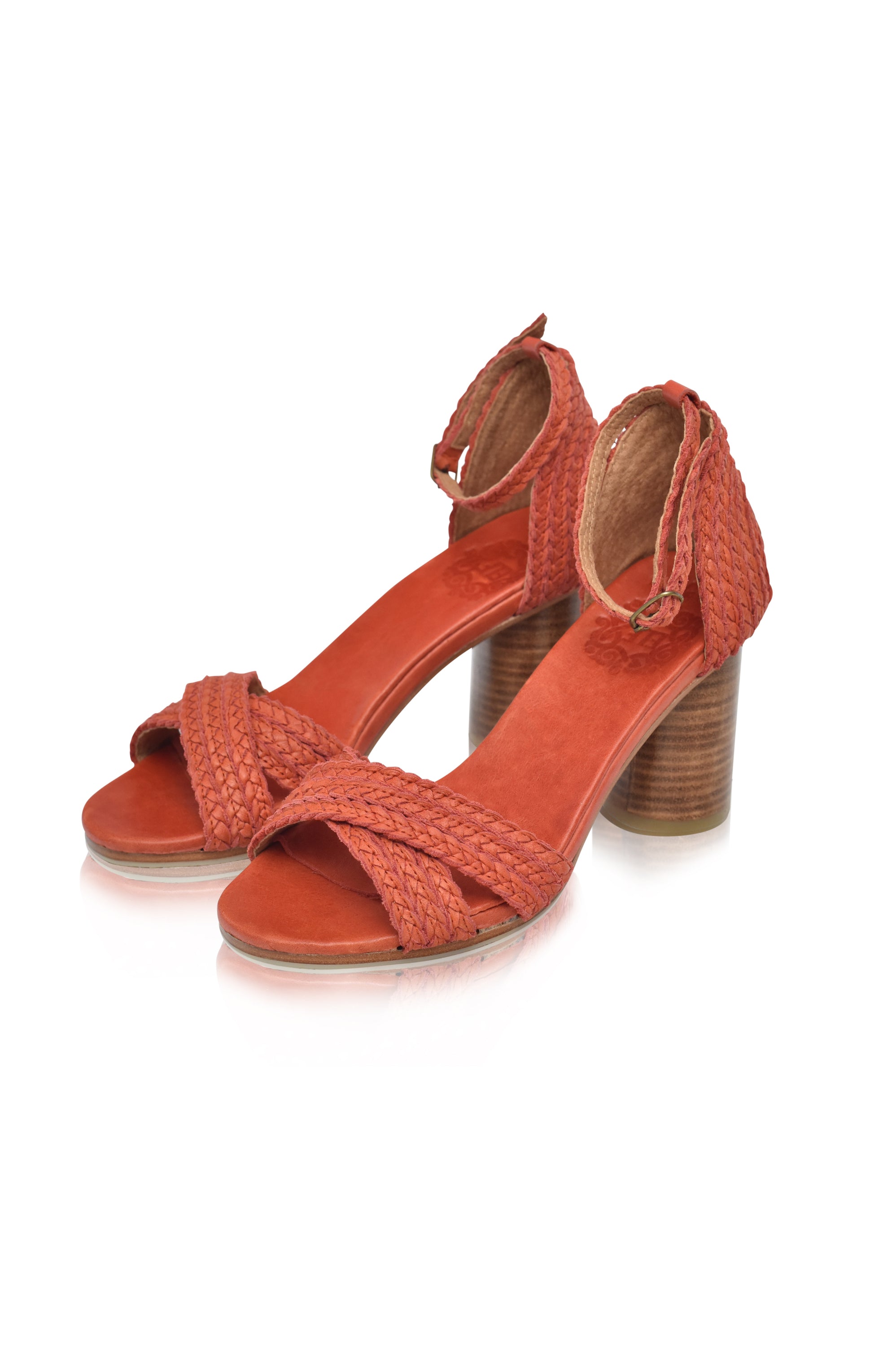 A pair of Bahamas Block Heel Sandals featuring a woven design, adjustable ankle strap, and a 7 cm wooden heel, perfect for stylish comfort.