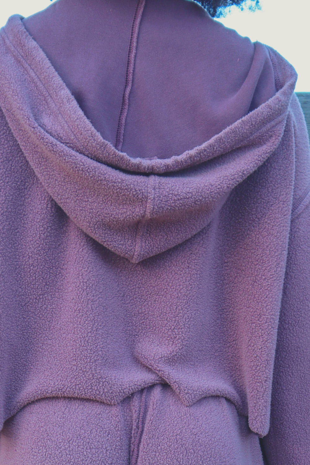 Baja Hoodie in sage green, showcasing its boxy silhouette and eco-friendly fabric, perfect for casual wear.