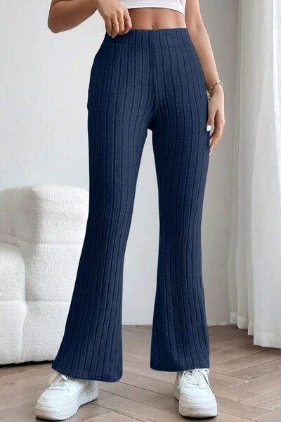 Basic Bae Full Size Ribbed High Waist Flare Pants in black, showcasing ribbed texture and high waist design.