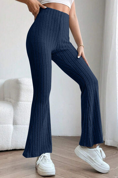 Basic Bae Full Size Ribbed High Waist Flare Pants in black, showcasing ribbed texture and high waist design.