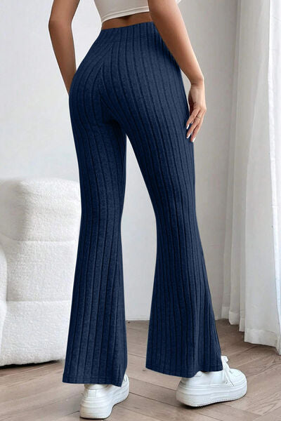 Basic Bae Full Size Ribbed High Waist Flare Pants in black, showcasing ribbed texture and high waist design.