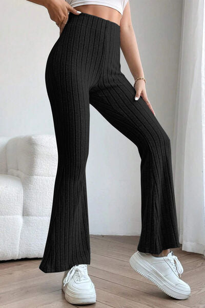 Basic Bae Full Size Ribbed High Waist Flare Pants in black, showcasing ribbed texture and high waist design.