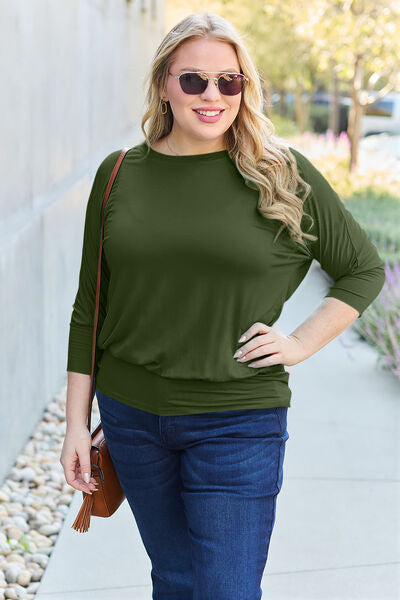 Basic Bae Full Size Round Neck Batwing Sleeve Blouse in a stylish design, showcasing its round neck and batwing sleeves.