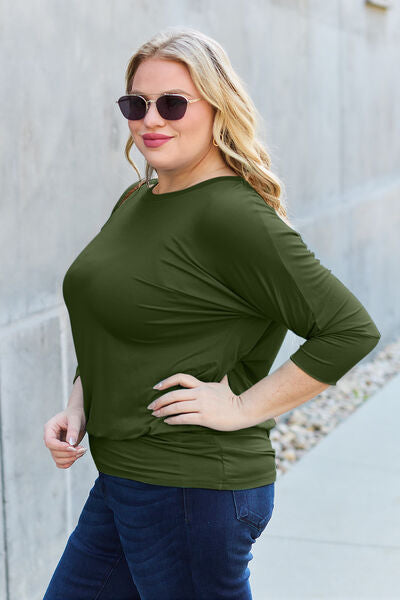 Basic Bae Full Size Round Neck Batwing Sleeve Blouse in a stylish design, showcasing its round neck and batwing sleeves.