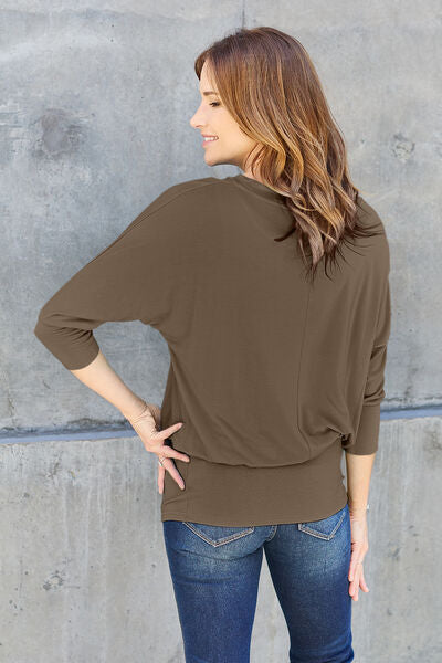 Basic Bae Full Size Round Neck Batwing Sleeve Blouse in a stylish design, showcasing its round neck and batwing sleeves.