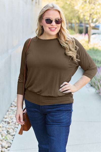 Basic Bae Full Size Round Neck Batwing Sleeve Blouse in a stylish design, showcasing its round neck and batwing sleeves.