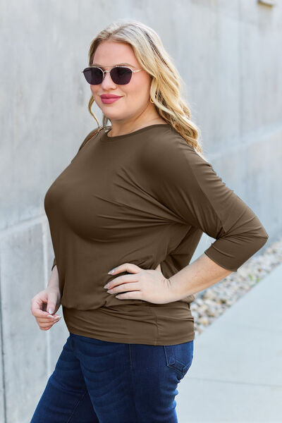 Basic Bae Full Size Round Neck Batwing Sleeve Blouse in a stylish design, showcasing its round neck and batwing sleeves.