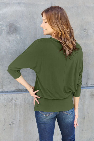 Basic Bae Full Size Round Neck Batwing Sleeve Blouse in a stylish design, showcasing its round neck and batwing sleeves.