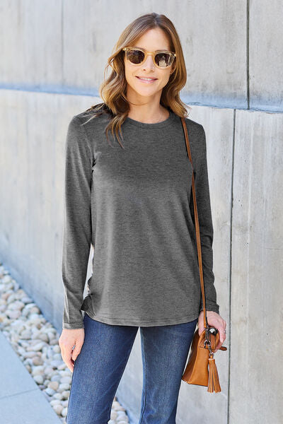 Basic Bae Full Size Round Neck Long Sleeve Top in various sizes, showcasing its classic design and soft fabric.