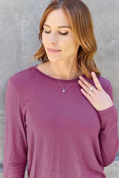 Basic Bae Full Size Round Neck Long Sleeve Top in various sizes, showcasing its classic design and soft fabric.