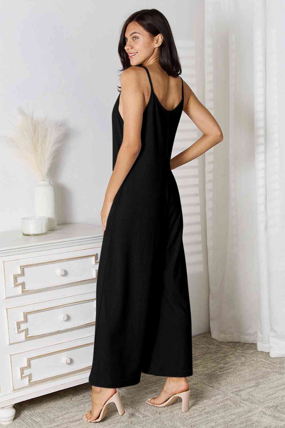 Basic Bae Full Size Spaghetti Strap V-Neck Jumpsuit in black, showcasing its elegant V-neckline and delicate spaghetti straps.