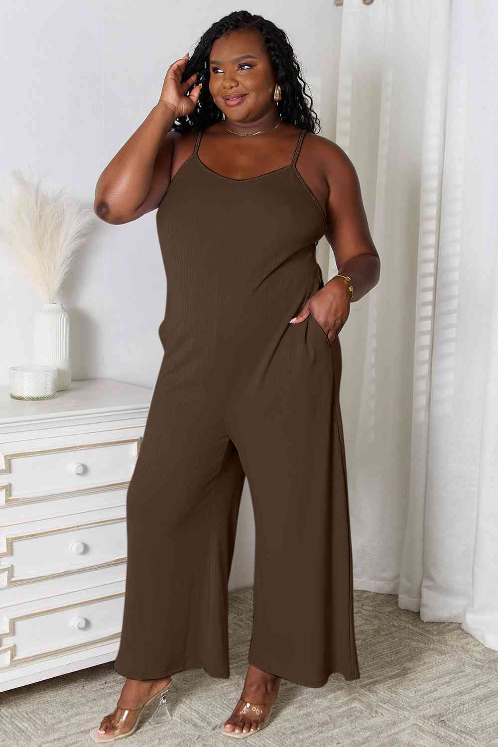 Basic Bae Full Size Spaghetti Strap V-Neck Jumpsuit in black, showcasing its elegant V-neckline and delicate spaghetti straps.