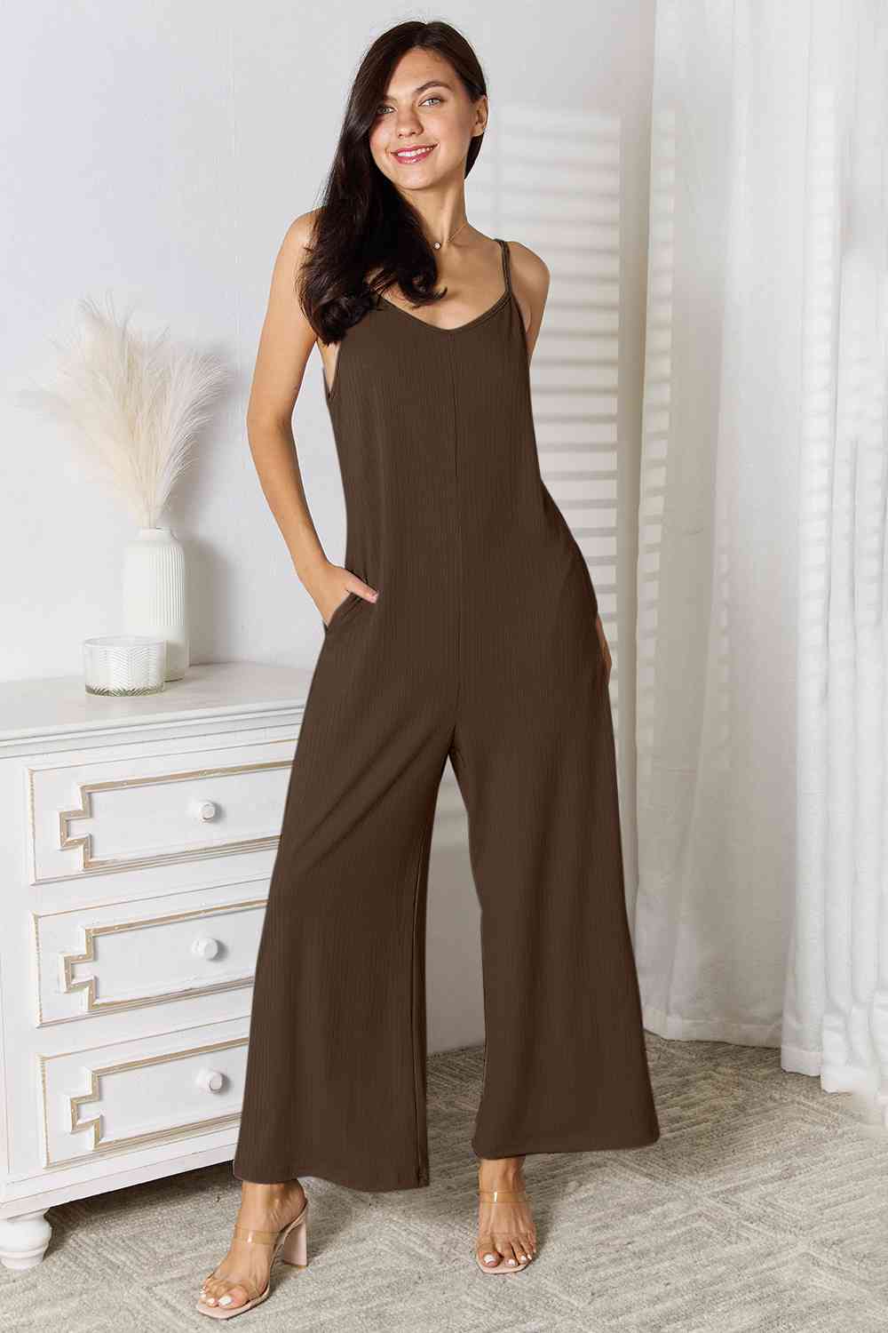 Basic Bae Full Size Spaghetti Strap V-Neck Jumpsuit in black, showcasing its elegant V-neckline and delicate spaghetti straps.