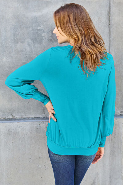 Basic Bae Full Size V-Neck Lantern Sleeve Blouse in soft fabric with elegant lantern sleeves.