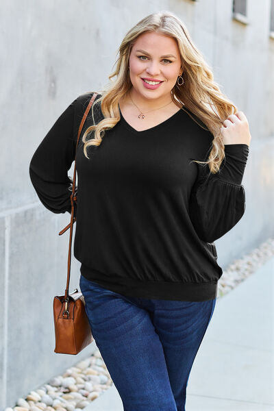 Basic Bae Full Size V-Neck Lantern Sleeve Blouse in soft fabric with elegant lantern sleeves.