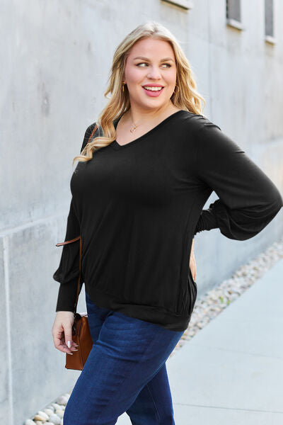 Basic Bae Full Size V-Neck Lantern Sleeve Blouse in soft fabric with elegant lantern sleeves.