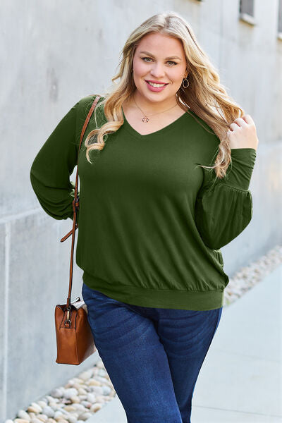 Basic Bae Full Size V-Neck Lantern Sleeve Blouse in soft fabric with elegant lantern sleeves.