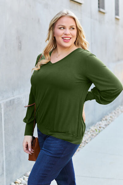 Basic Bae Full Size V-Neck Lantern Sleeve Blouse in soft fabric with elegant lantern sleeves.