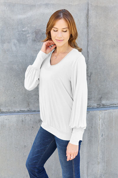 Basic Bae Full Size V-Neck Lantern Sleeve Blouse in soft fabric with elegant lantern sleeves.