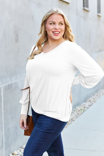 Basic Bae Full Size V-Neck Lantern Sleeve Blouse in soft fabric with elegant lantern sleeves.