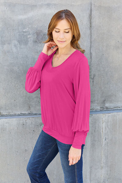 Basic Bae Full Size V-Neck Lantern Sleeve Blouse in soft fabric with elegant lantern sleeves.