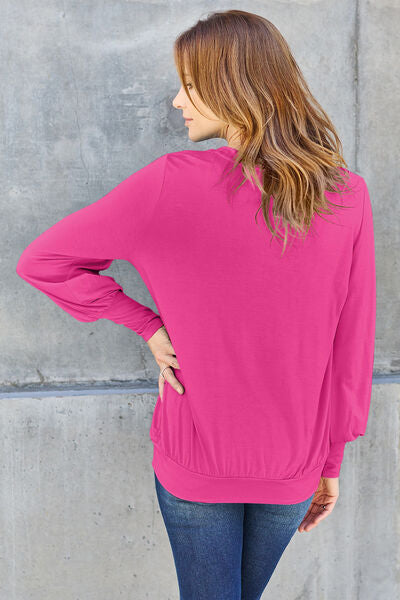 Basic Bae Full Size V-Neck Lantern Sleeve Blouse in soft fabric with elegant lantern sleeves.