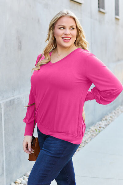 Basic Bae Full Size V-Neck Lantern Sleeve Blouse in soft fabric with elegant lantern sleeves.