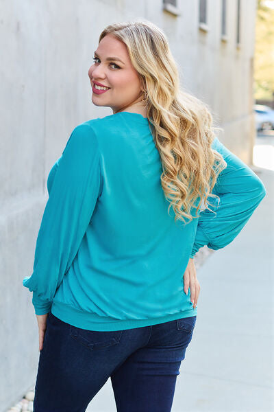 Basic Bae Full Size V-Neck Lantern Sleeve Blouse in soft fabric with elegant lantern sleeves.