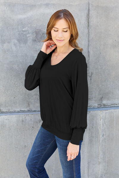 Basic Bae Full Size V-Neck Lantern Sleeve Blouse in soft fabric with elegant lantern sleeves.