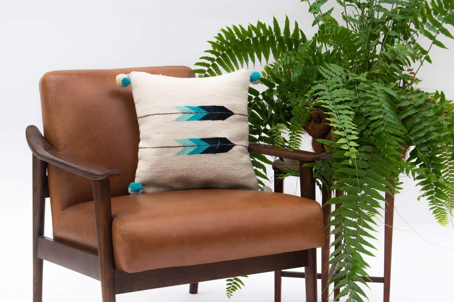 Baxa Native American Pillow Cover featuring a blue arrow design, handcrafted from 100% wool, showcasing artisan craftsmanship.