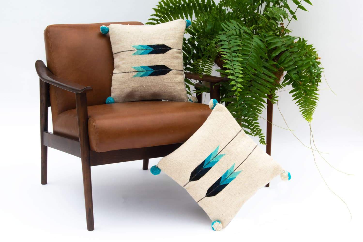 Baxa Native American Pillow Cover featuring a blue arrow design, handcrafted from 100% wool, showcasing artisan craftsmanship.