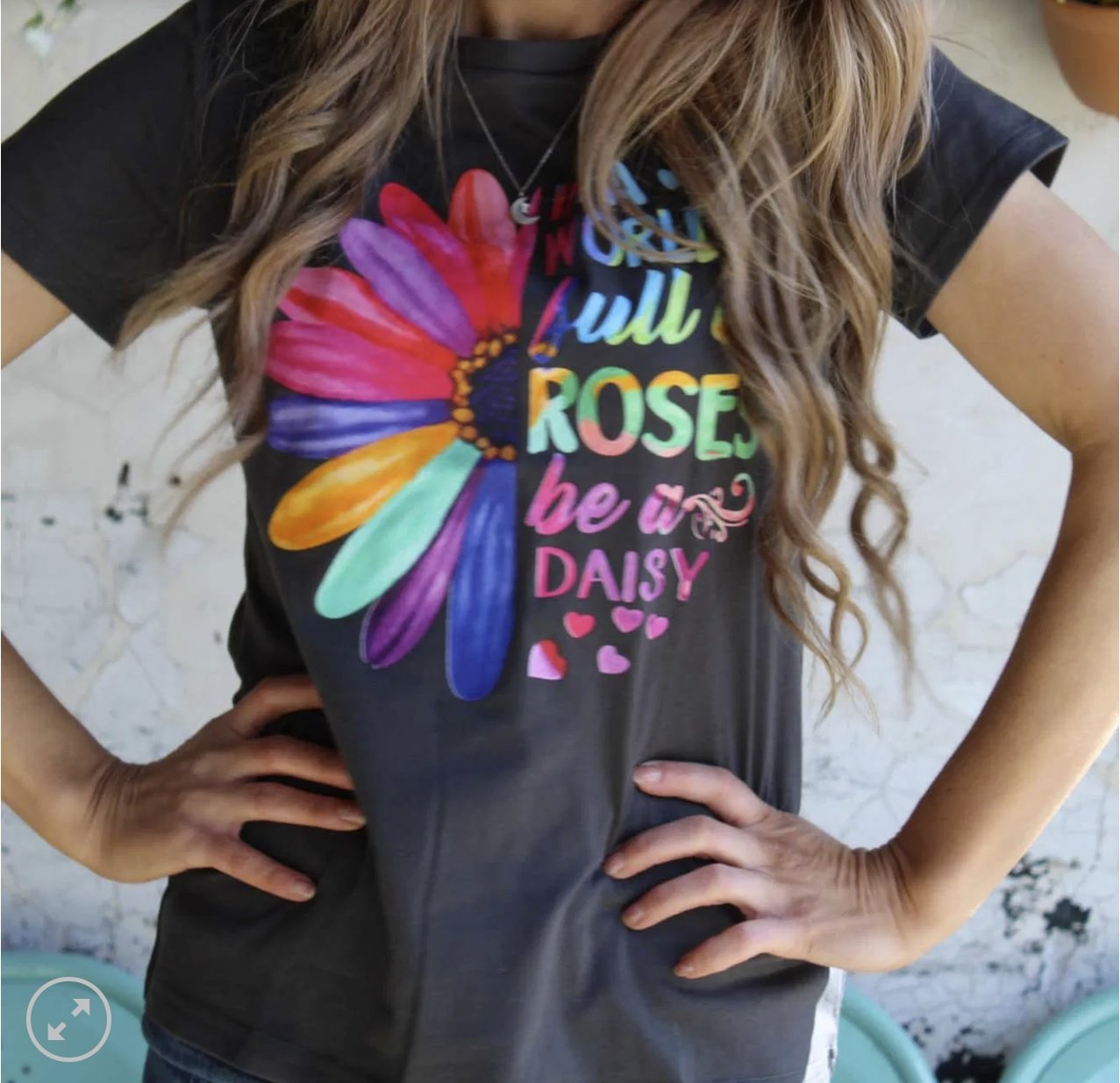 A stylish Be a Daisy Tee featuring a trendy graphic on a lightweight cotton jersey fabric, perfect for casual wear.