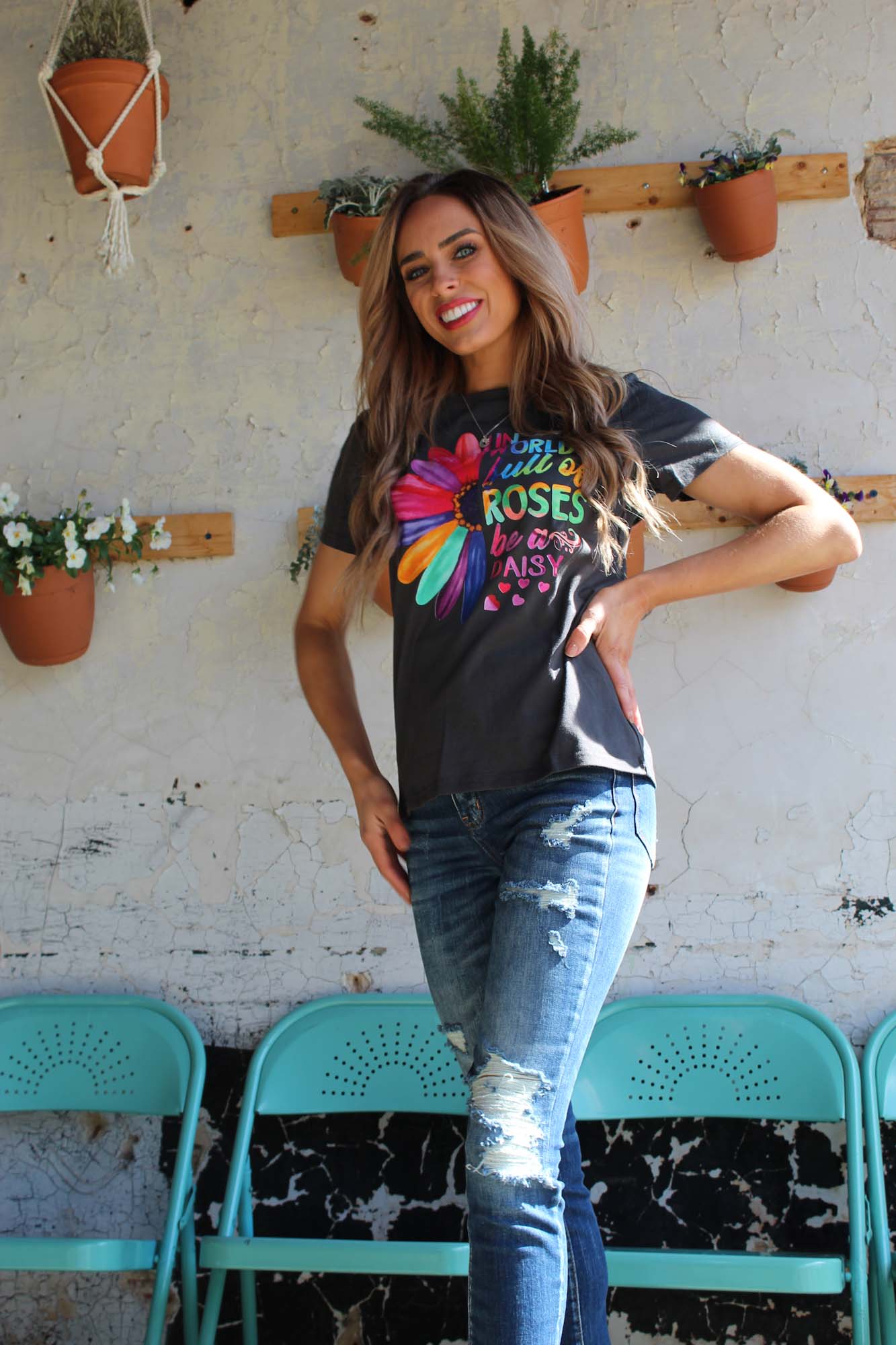 A stylish Be a Daisy Tee featuring a trendy graphic on a lightweight cotton jersey fabric, perfect for casual wear.