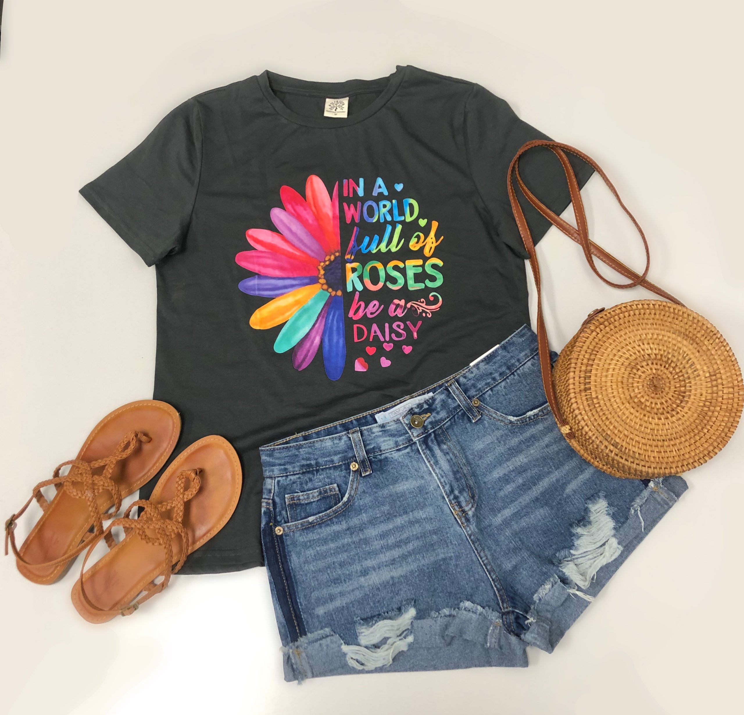 A stylish Be a Daisy Tee featuring a trendy graphic on a lightweight cotton jersey fabric, perfect for casual wear.