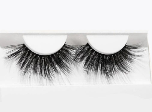 BE BOLD Lashes displayed on a white background, showcasing their luxurious faux mink fibers and dramatic volume.